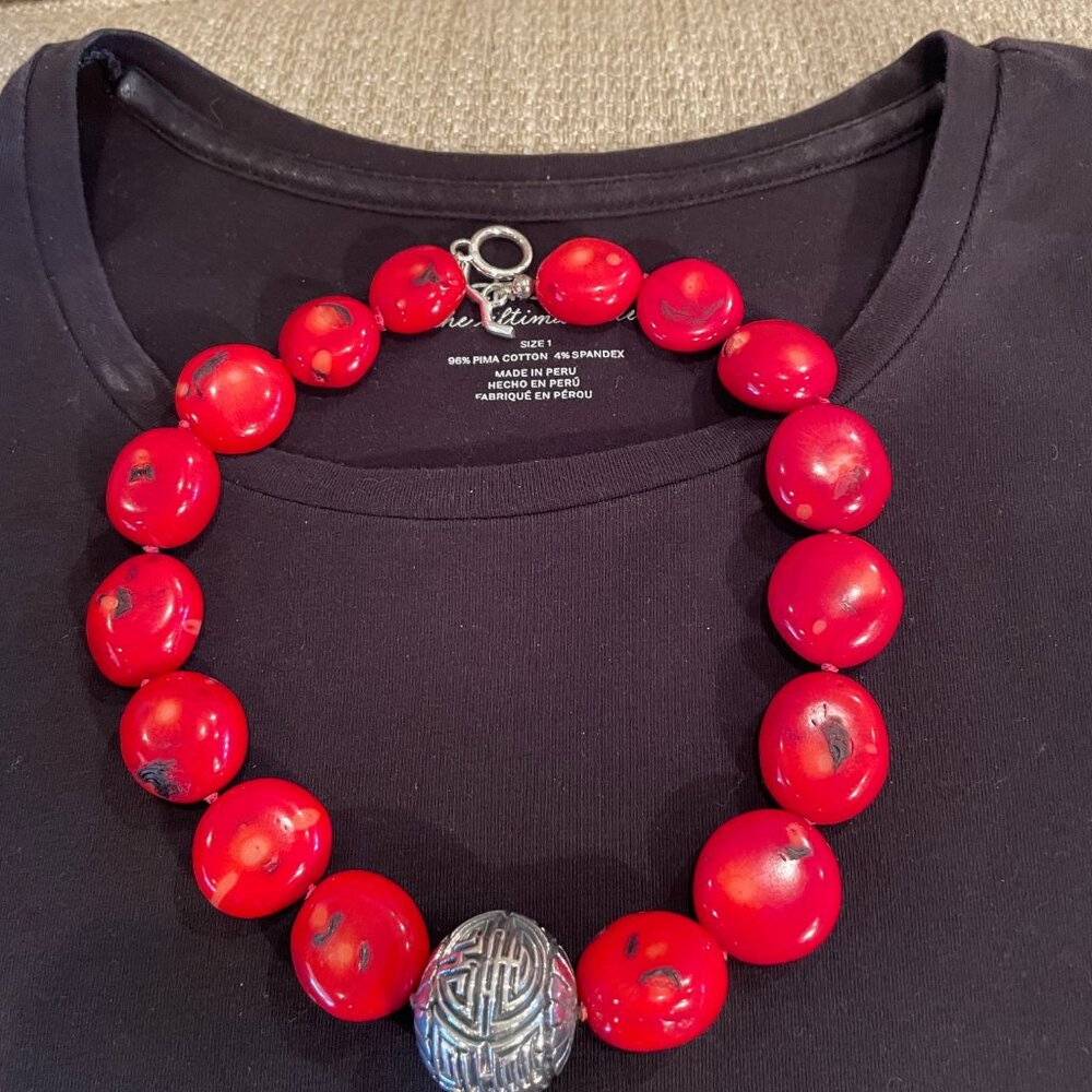 Coral necklace with large silver decorative ball and matching earrings